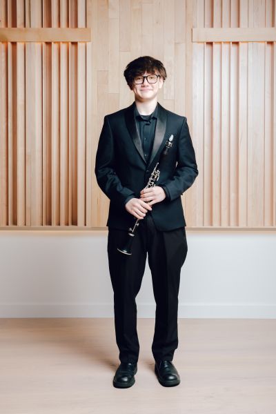 Photo of Kaden Prichard holding a clarinet
