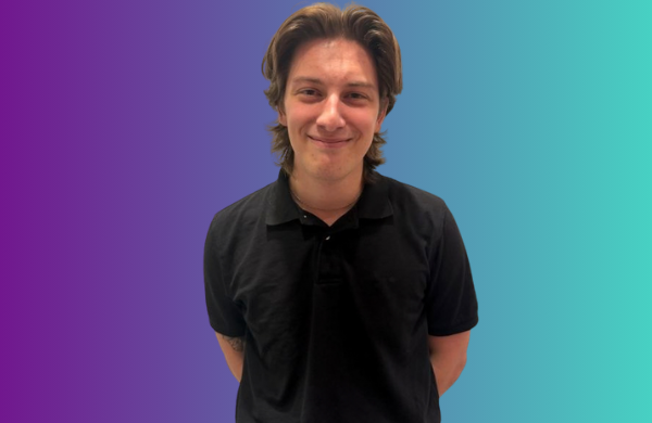 Aidan in front of purple teal gradient
